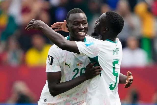 Senegal's Pape Gueye celebrates scoring their third goal with Idrissa Gueye