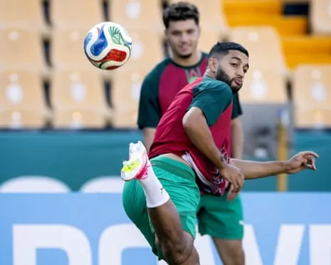 Ismael Saibari controls the ball mid-air in green and red training kit during practice