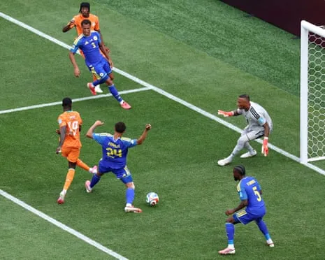 Nicolas Pepe slots the ball home to give Cote d'Ivoire the lead.
