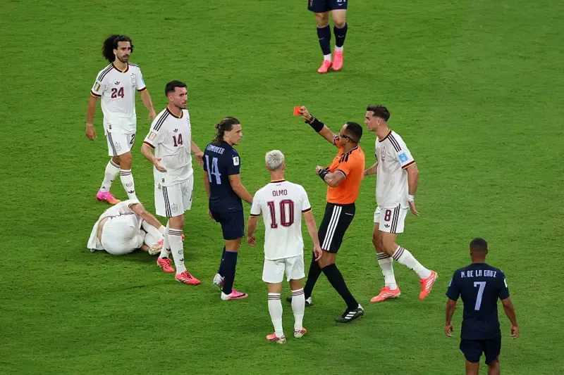 Agustin Canobbio #14 of Uruguay receives a red card