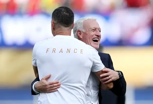 Didier Deschamps, Head Coach of France, celebrates victory with coaching staff