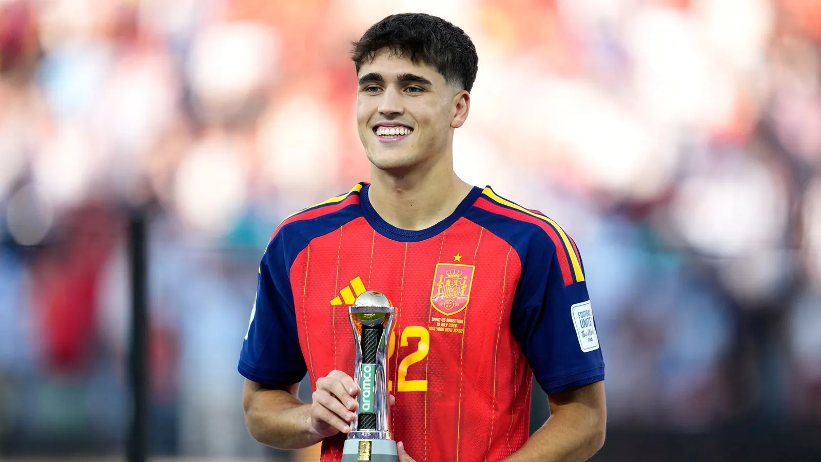 Spain's Pau Cubarsi poses with the trophy for 'Young player of the Tournament' award (AP Photo/Ashley Landis)