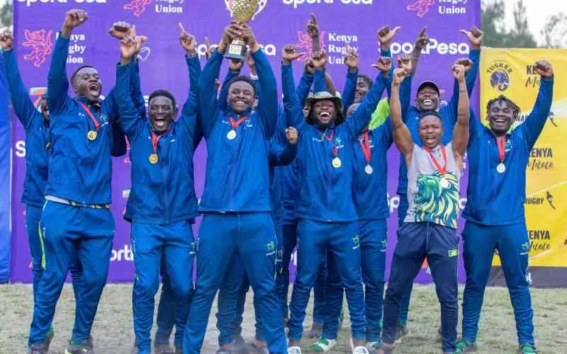 KCB RFC players celebrate with the Prinsloo Sevens trophy.[Jimmy Mburu, Standard]
