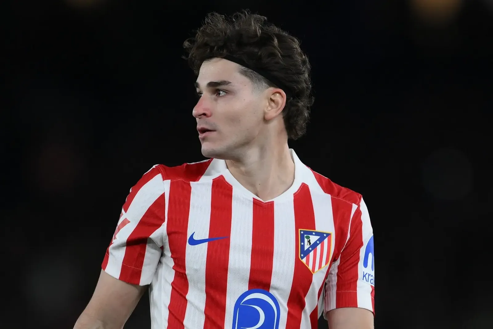 Julian Alvarez wearing the red and white striped Atletico Madrid home jersey