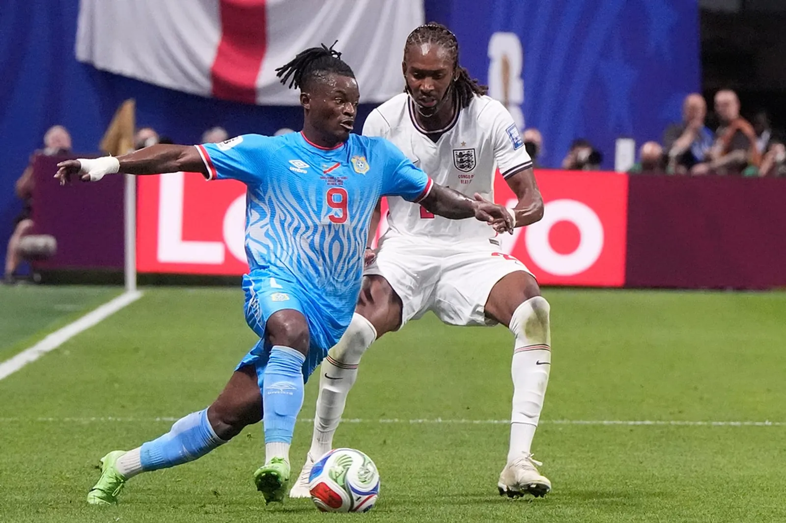 Congo's Brian Cipenga dribbles past England's Djed Spence during a World Cup round of 32 soccer match in Atlanta, Wednesday, July 1, 2026.
