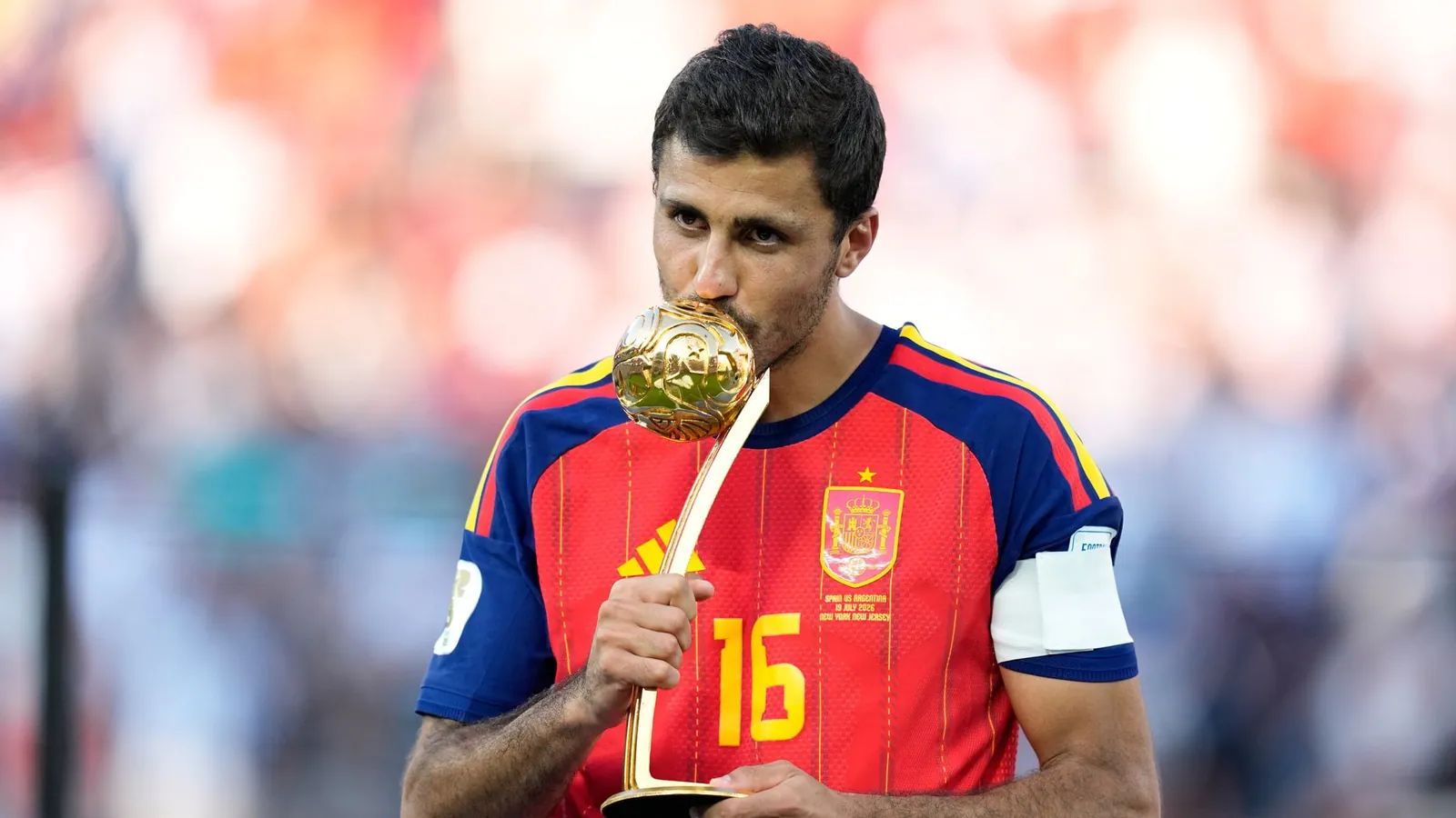Spain's Rodri poses with the award for the World Cup's best player (AP Photo/Ashley Landis)