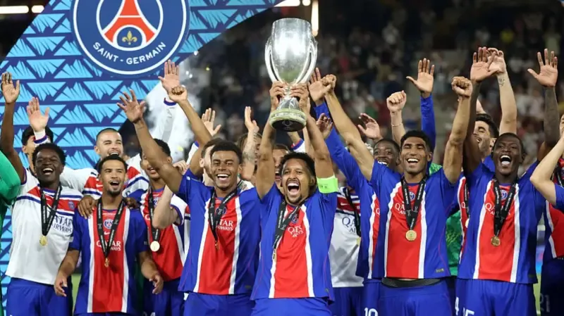 Marquinhos of Paris Saint-Germain lifts the UEFA Super Cup trophy after his team's victory in the UEFA Super Cup 2026 match between Paris Saint-Germain and Aston Villa at Stadion Salzburg.
