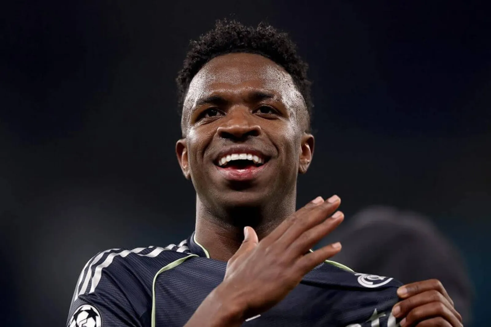 Vinicius Junior of Real Madrid smiling.